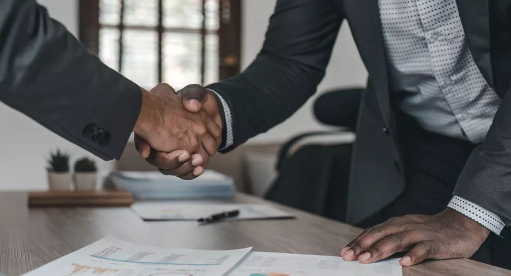 a close-up of a man shaking hands